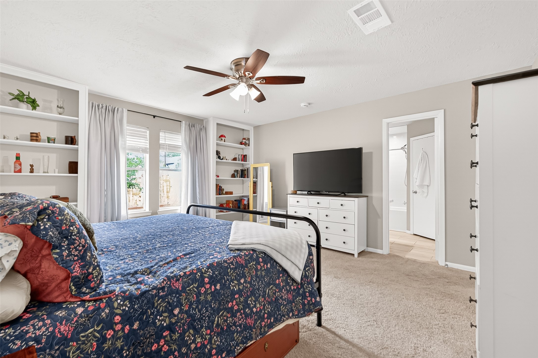 17611 Sorrell Ridge Drive Spring, TX 77388 - Photo 45 of 50 a bedroom with a bed and a flat screen tv