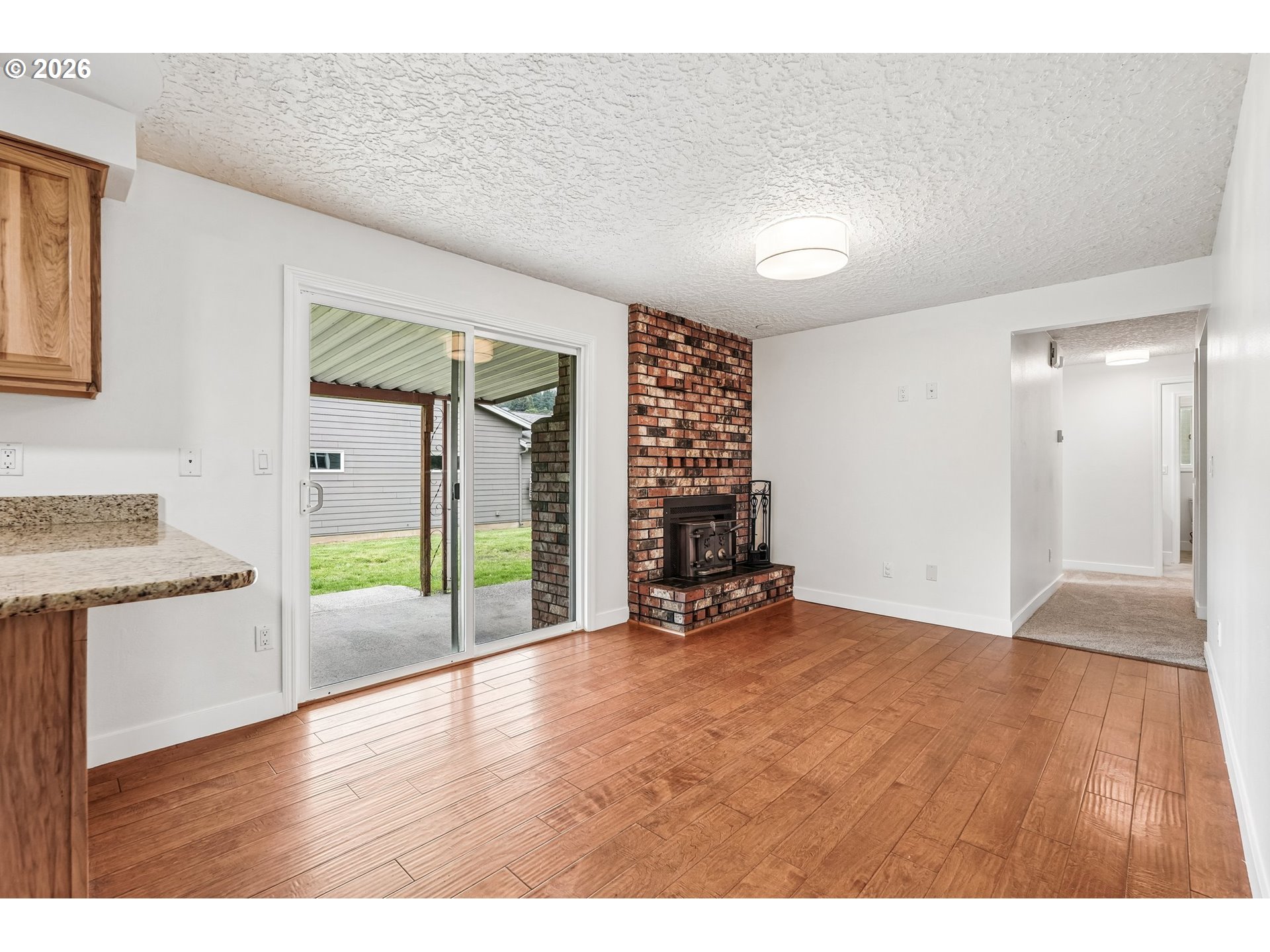 22600 Northeast 28th Street Camas, WA 98607 - Photo 14 of 48 a view of an empty room with a window and wooden floor