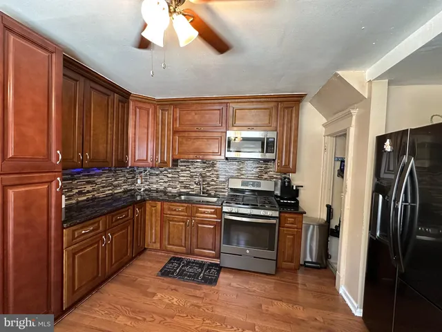 a bed room with a bed and a night stand