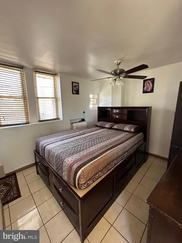 a gym room with furniture and a lamp