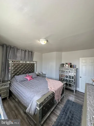 a bedroom with a bed and a view kitchen