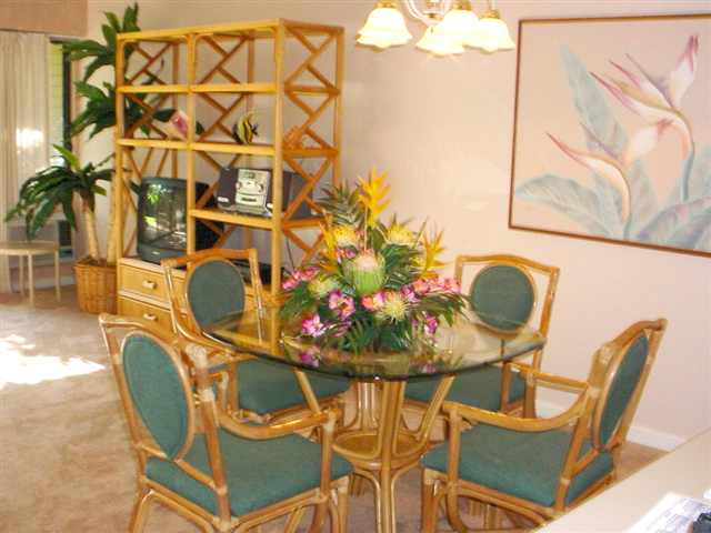 2777 South Kihei Road, Unit D104 Kihei, HI 96753 - Photo 2 of 8 a view of a dining room with furniture and wooden floor