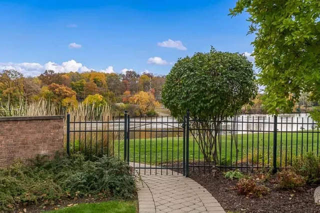a view of a house with a yard and sitting area