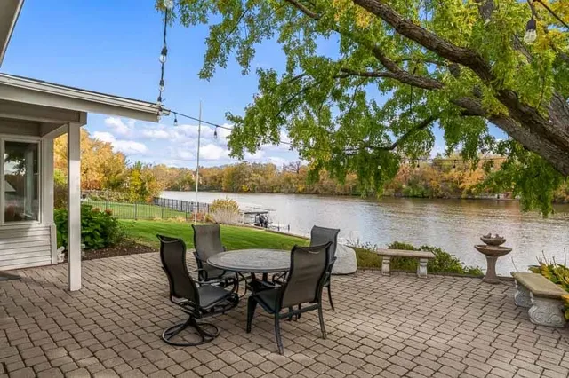 an aerial view of a house with a lake view