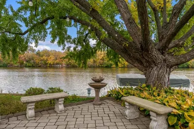 an aerial view of a house with a yard basket ball court