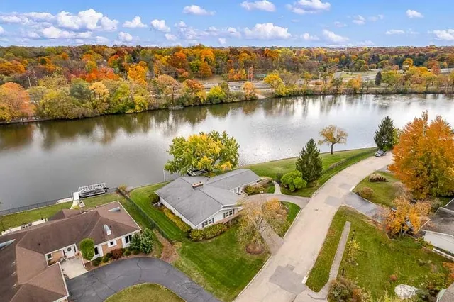 a kitchen with cabinets and chairs