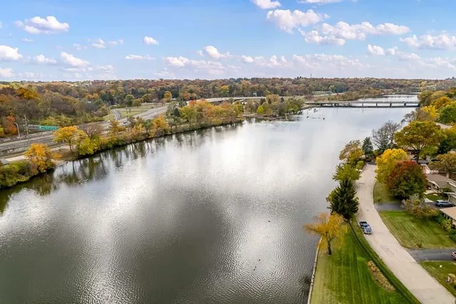 a view of a room with a table and chairs