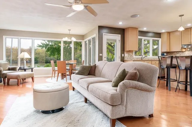 a bedroom with a large bed and a large window