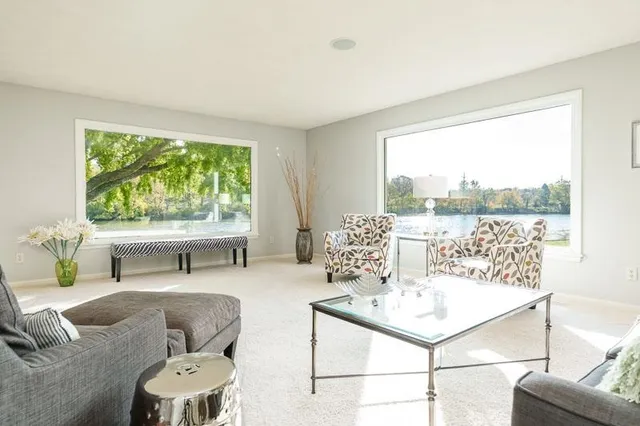 a bathroom with a double vanity sink a mirror and a shower