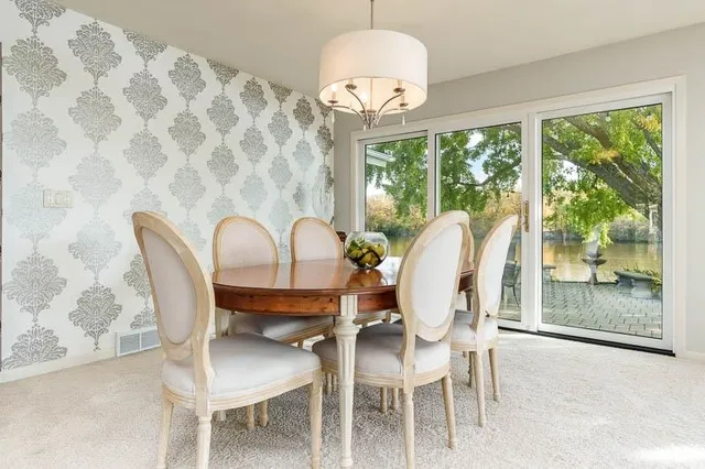 a room with furniture and wall paintings