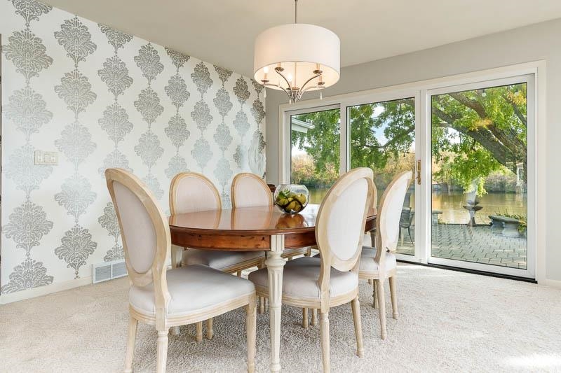 2303 Rock Terrace Rockford, IL 61103 - Photo 48 of 70 a view of a dining room with furniture wooden floor and a chandelier