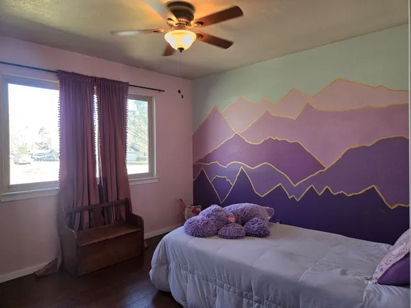 a bedroom with a bed and window