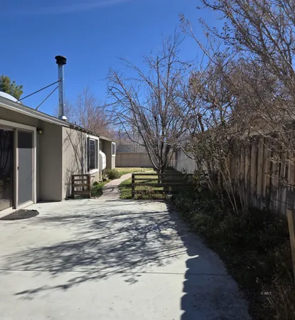 a view of a house with backyard