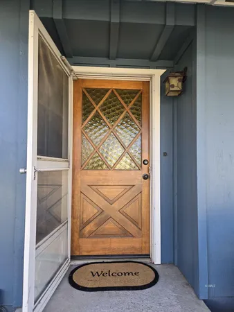 a view of a room with rack on the wall and a window