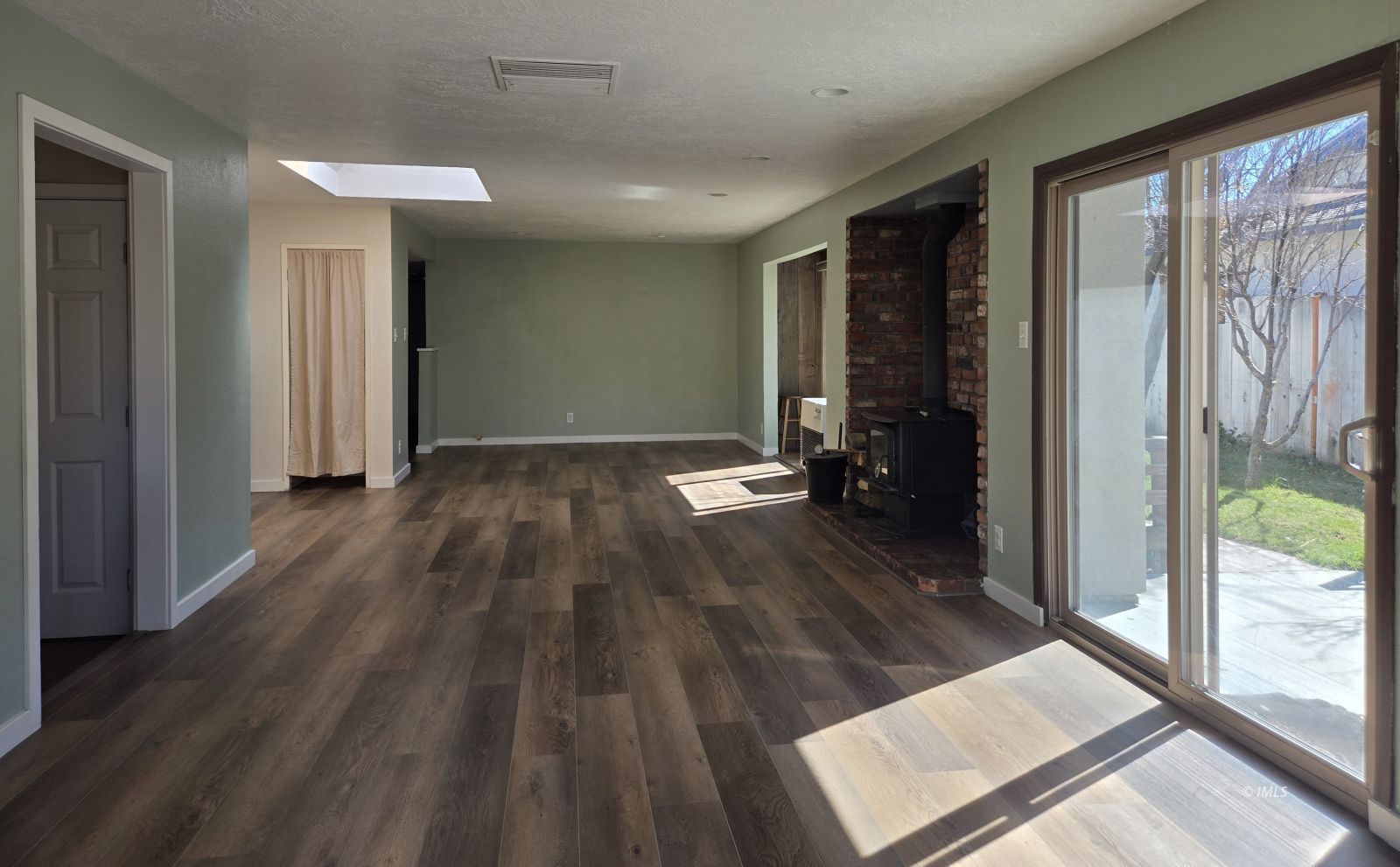 3028 Laurel Road Bishop, CA 93514 - Photo 4 of 21 a view of hallway with wooden floor and sliding glass door
