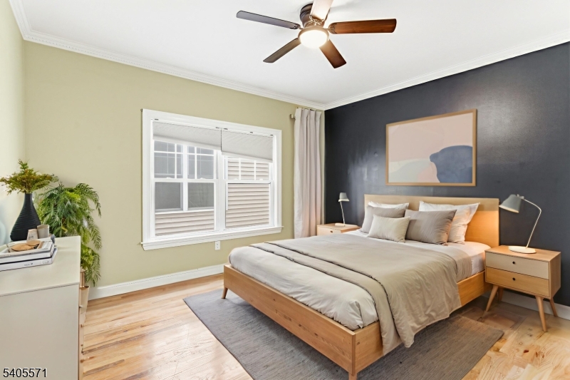 21 Freeman Street, Unit A2 Newark, NJ 07105 - Photo 18 of 24 a bedroom with a large bed and a window