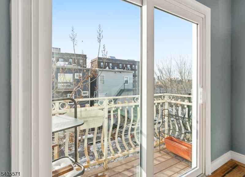 21 Freeman Street, Unit A2 Newark, NJ 07105 - Photo 20 of 24 a very nice looking room with a large window with kitchen view