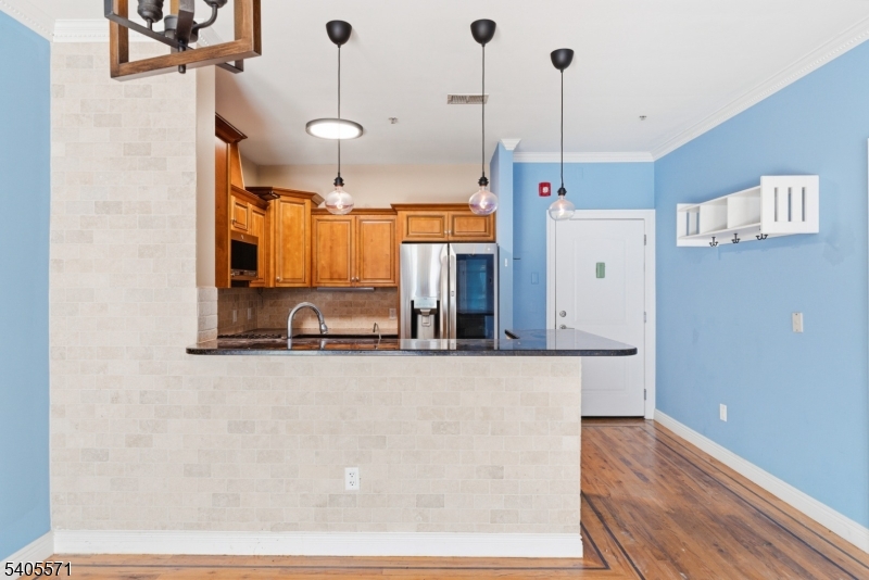 21 Freeman Street, Unit A2 Newark, NJ 07105 - Photo 10 of 24 a view of a kitchen with wooden floor