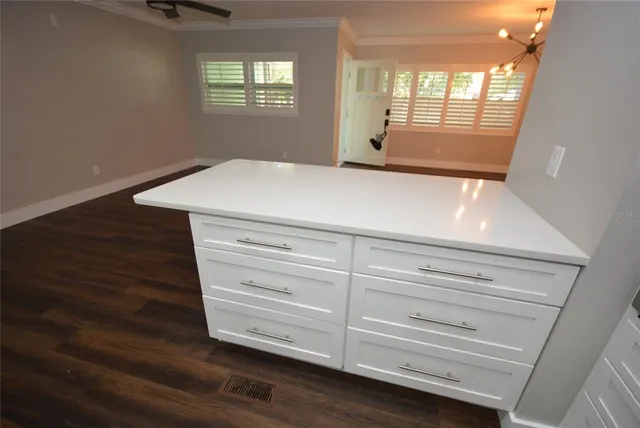 a kitchen with a sink and a window