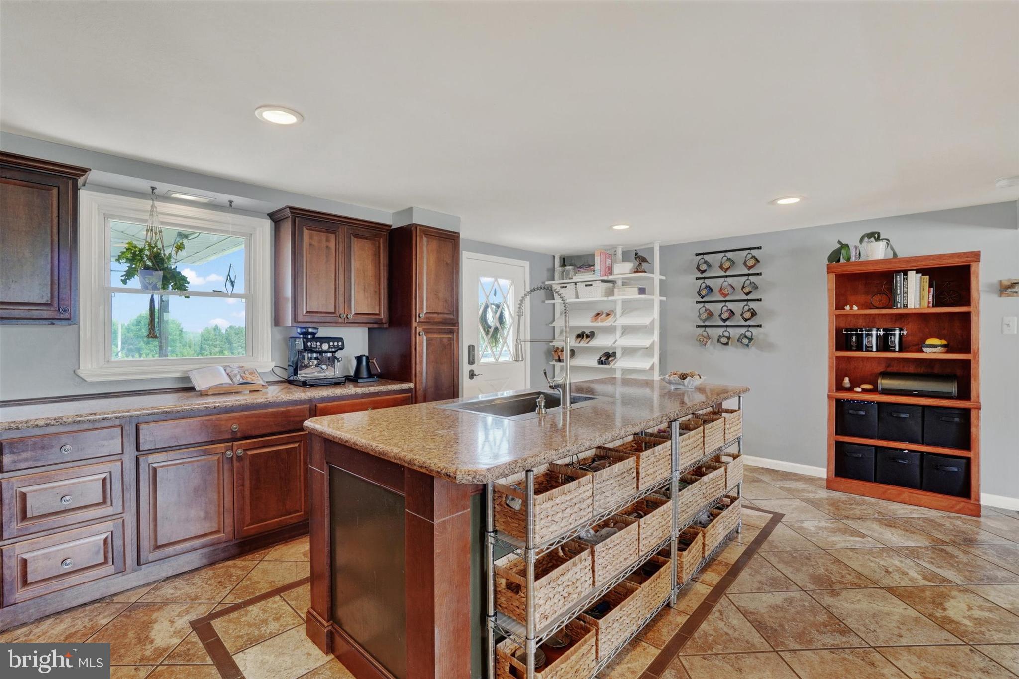 13174 Mont Road Felton, PA 17322 - Photo 26 of 39 a dining hall with stainless steel appliances granite countertop a stove and a sink