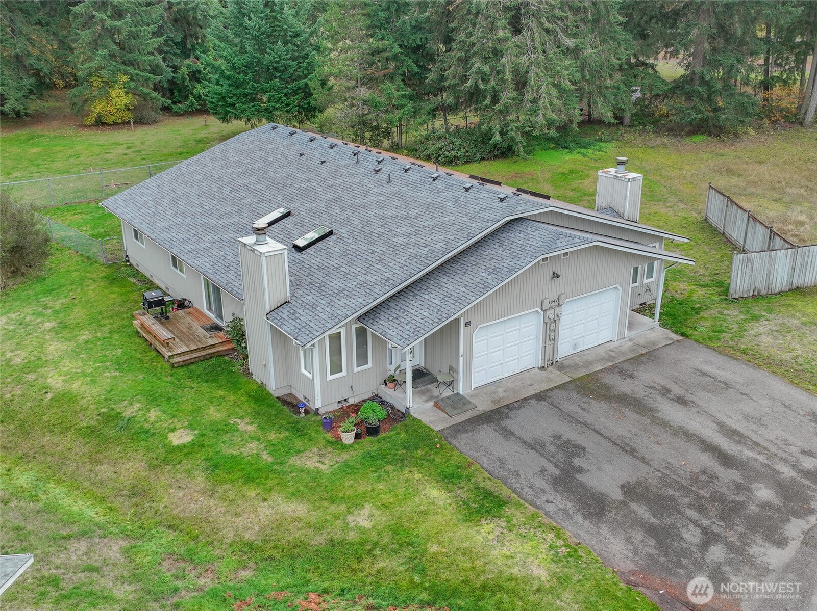 9041 Steilacoom Road Southeast Olympia, WA 98513 - Photo 1 of 12 an aerial view of a house having yard