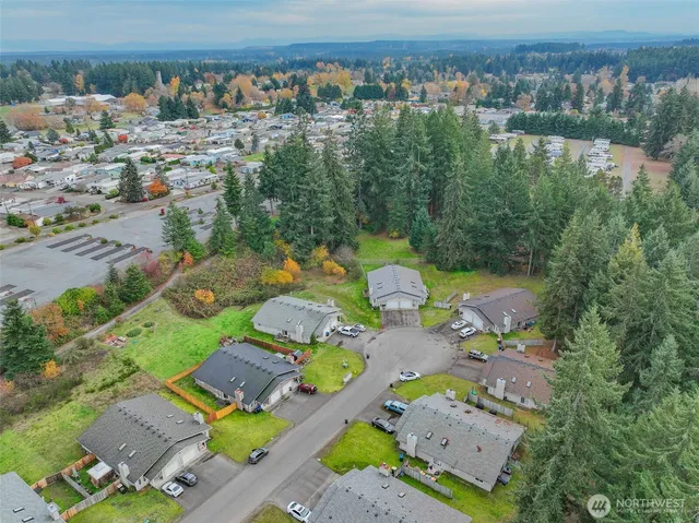 an aerial view of a house with a lake view