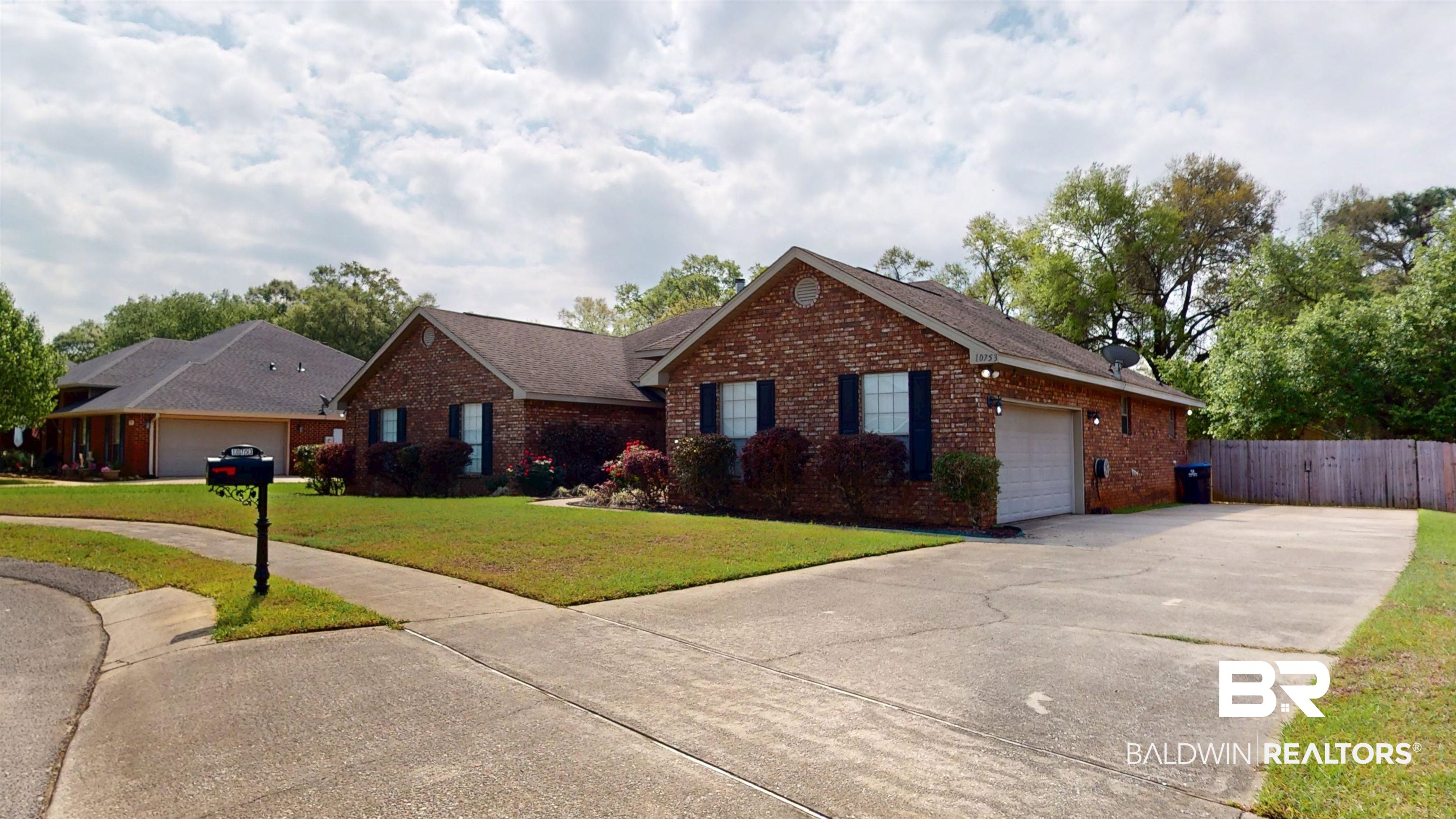 10753 Rigby Drive Mobile, AL 36695 - Photo 32 of 33 Deep driveway offers extra parking; oversized gate opens to the large, fenced back yard.
