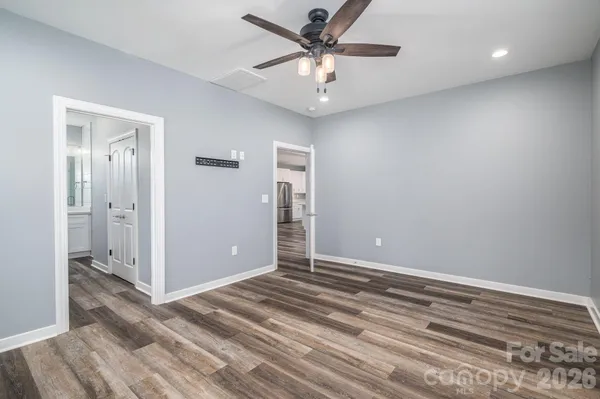 a bathroom with a shower sink and mirror