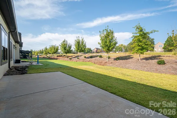 an aerial view of a house with outdoor space