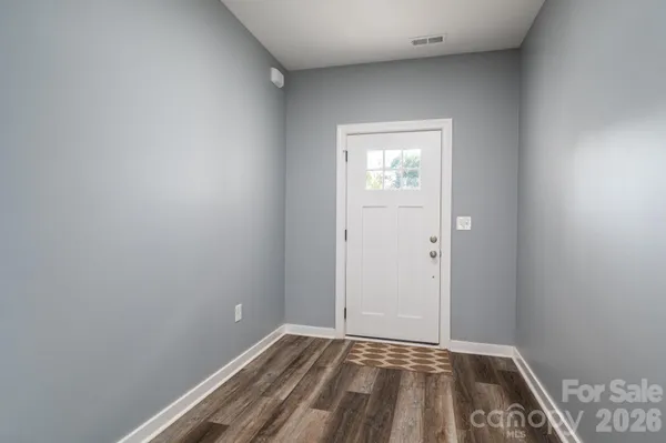 a view of an empty room and window