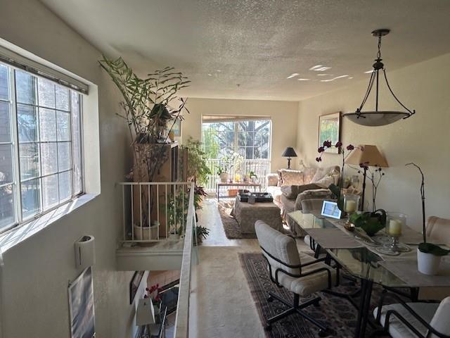 176 Seascape Ridge Drive Aptos, CA 95003 - Photo 2 of 9 a living room with furniture a chandelier and a floor to ceiling window