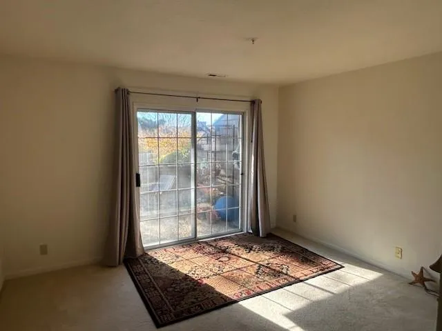 a view of an empty room and window