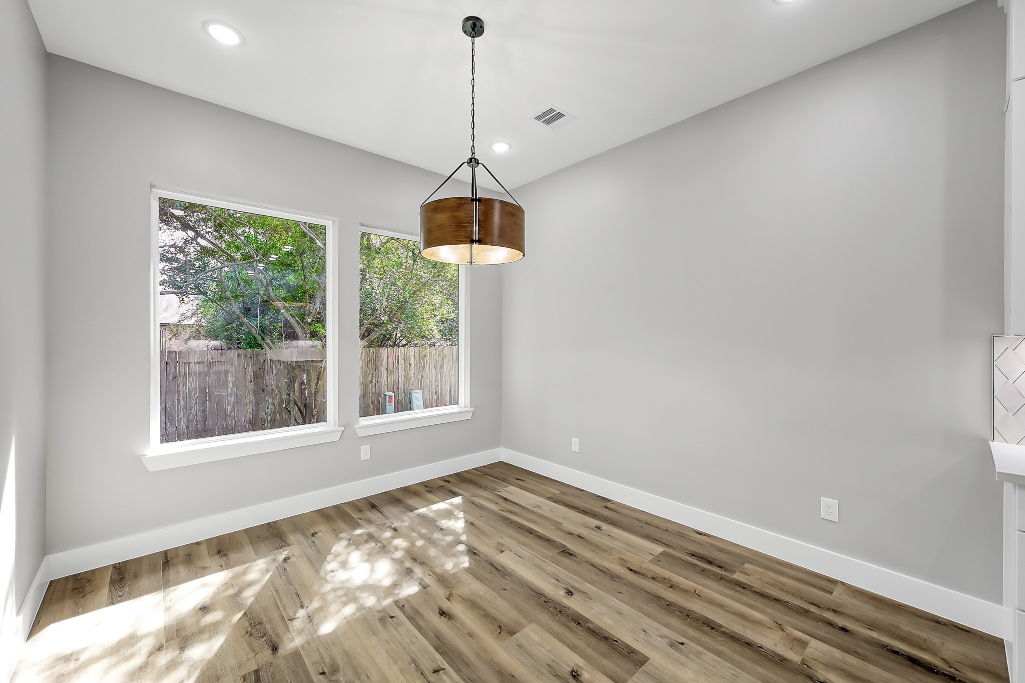 135 Wick Willow Road Montgomery, TX 77356 - Photo 21 of 50 a view of empty room with wooden floor and windows
