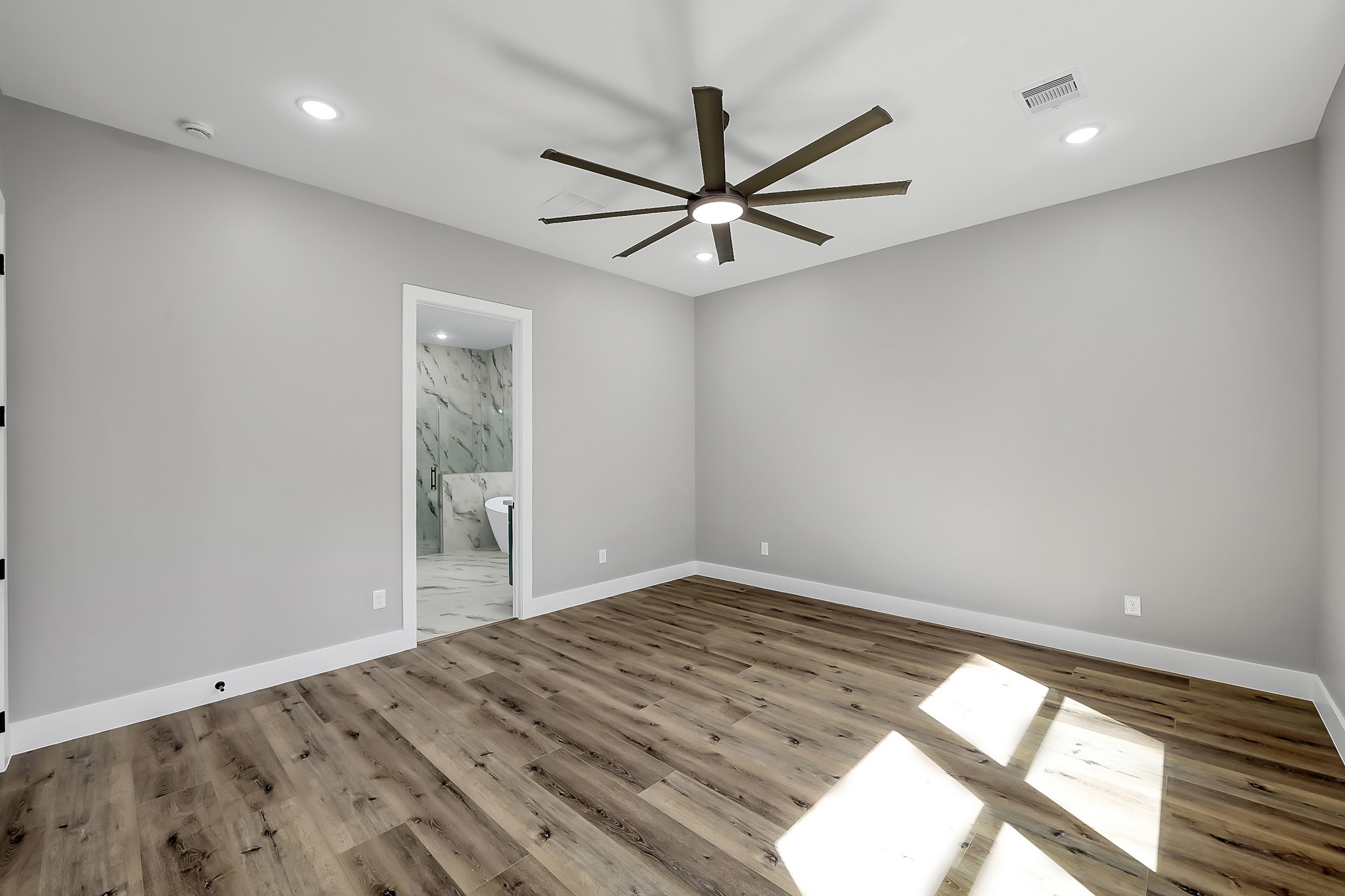135 Wick Willow Road Montgomery, TX 77356 - Photo 26 of 50 wooden floor in an empty room with a window
