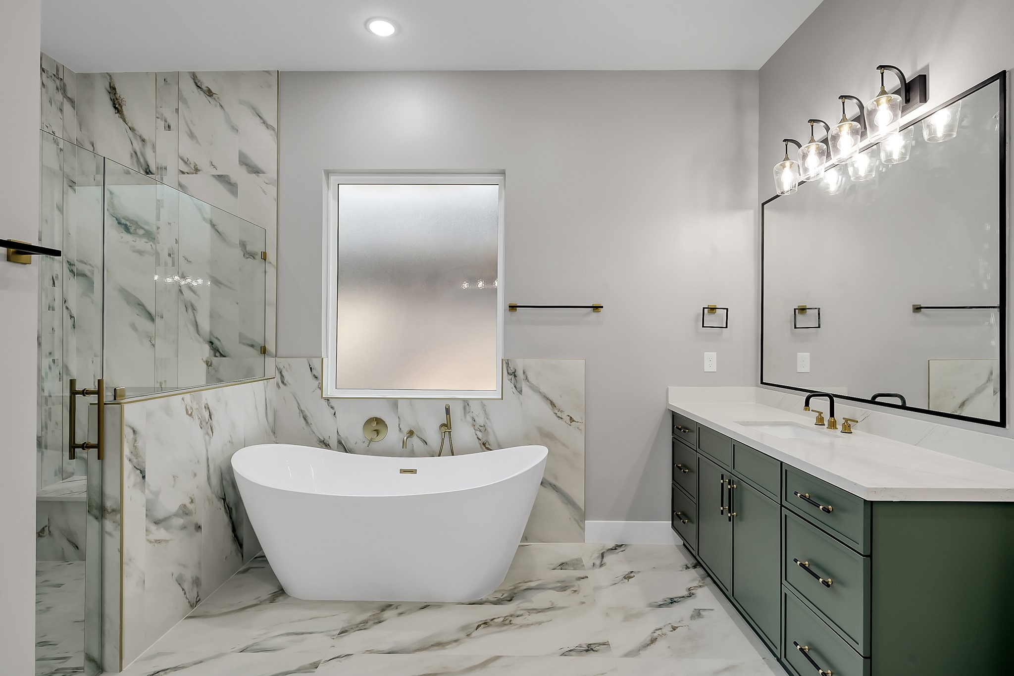 135 Wick Willow Road Montgomery, TX 77356 - Photo 27 of 50 a bathroom with a bathtub and double sink