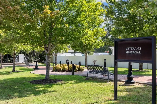 a view of outdoor space with deck and trees