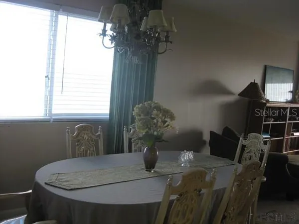 a dining room with furniture and window