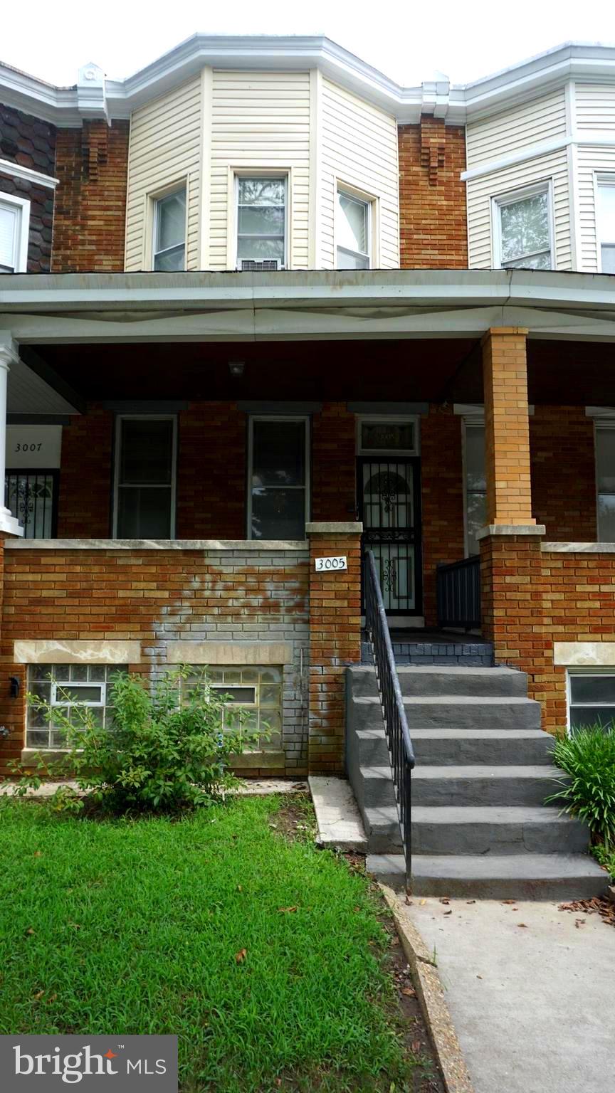3005 Belair Road Baltimore, MD 21213 - Photo 1 of 33 a front view of a house with a yard