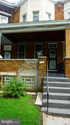 a bathroom with a sink and mirror with bathtub