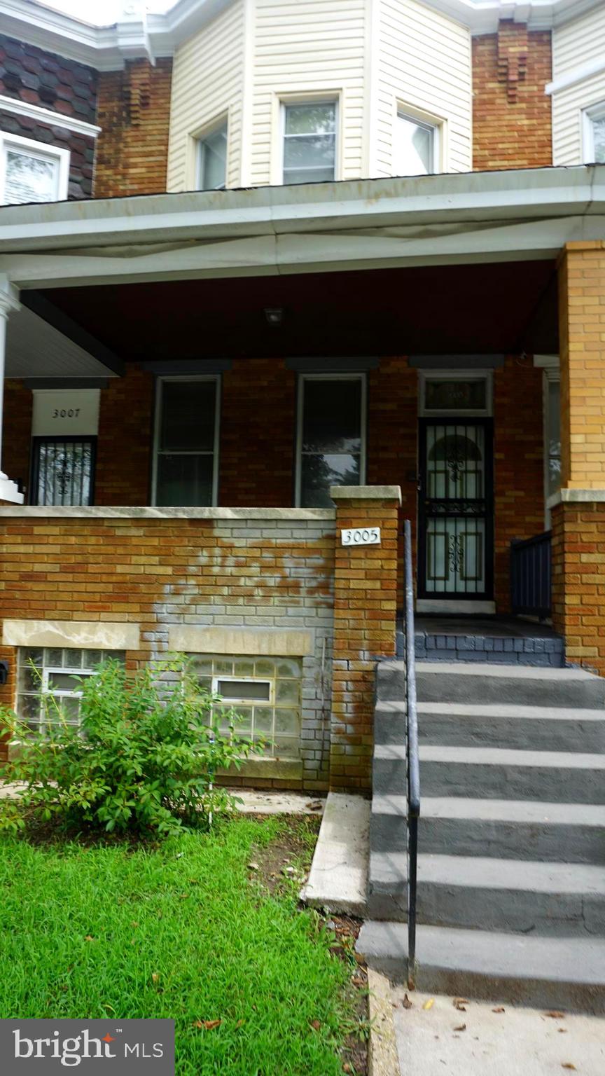 3005 Belair Road Baltimore, MD 21213 - Photo 25 of 33 a front view of a house with a garden