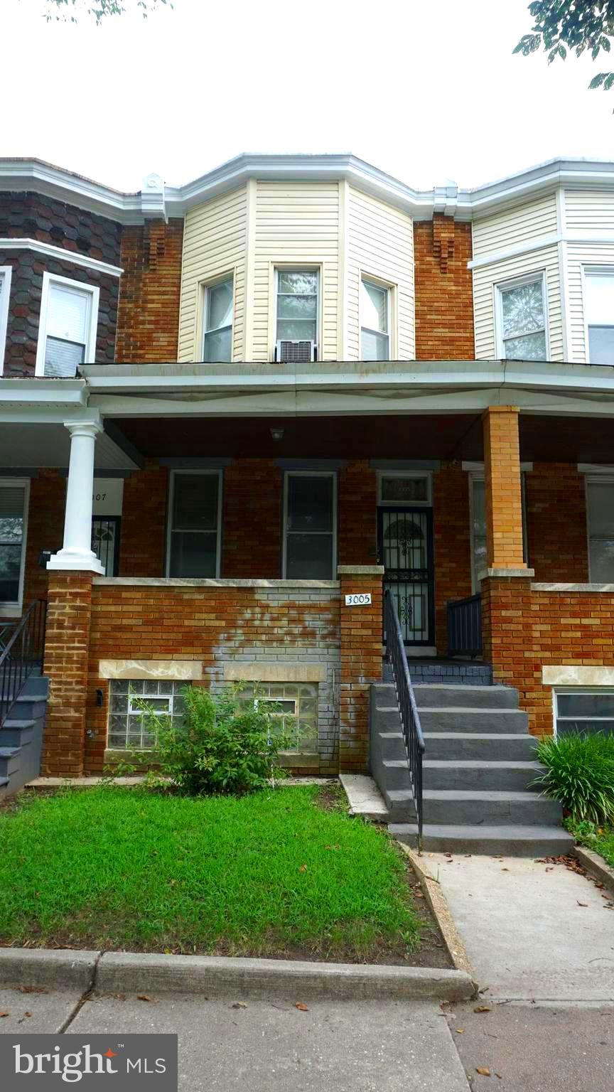 3005 Belair Road Baltimore, MD 21213 - Photo 26 of 33 a front view of a house with a yard