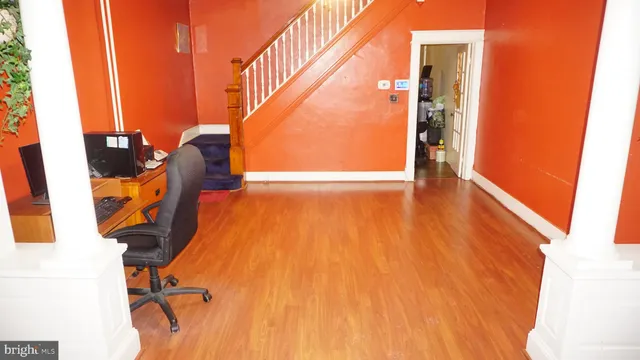 an entryway with wooden floor