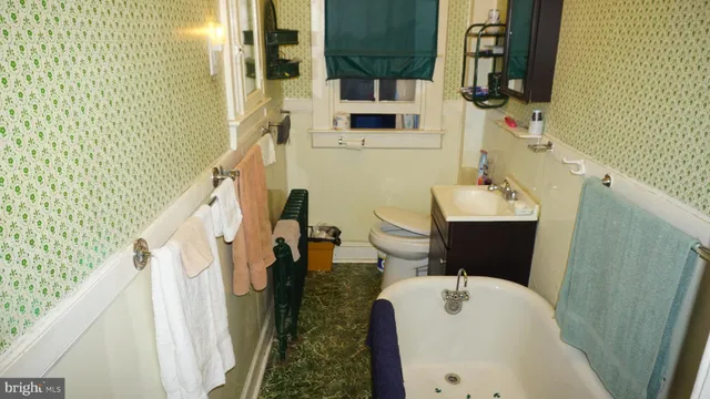 a bathroom with a sink a mirror and shower