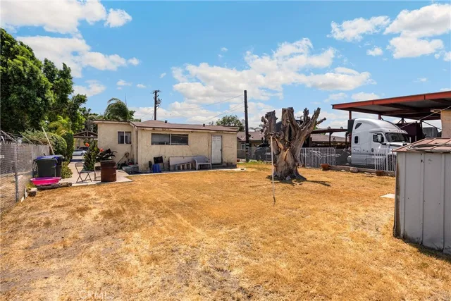 a view of a backyard of the house