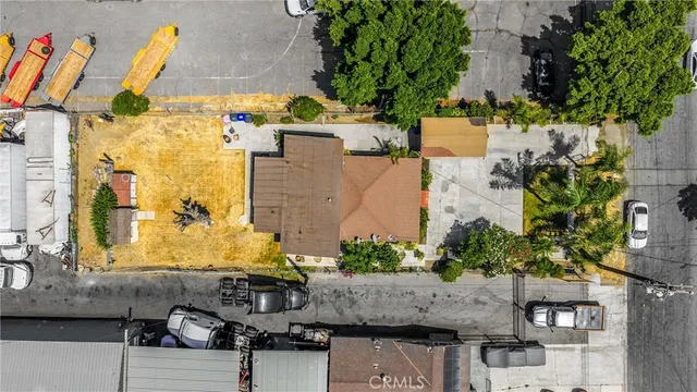 an aerial view of residential houses and city street
