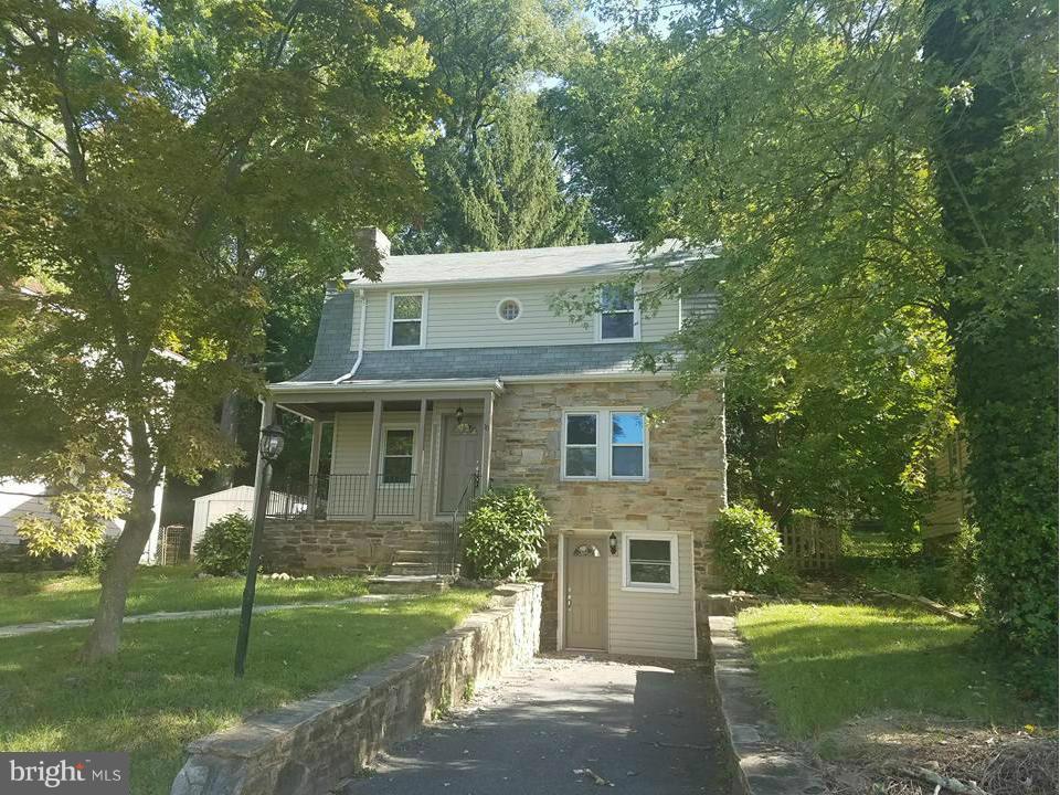 15 Summerfield Road Baltimore, MD 21207 - Photo 1 of 16 front view of a house with a garden