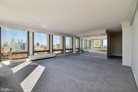 a view of empty room with floor to ceiling window