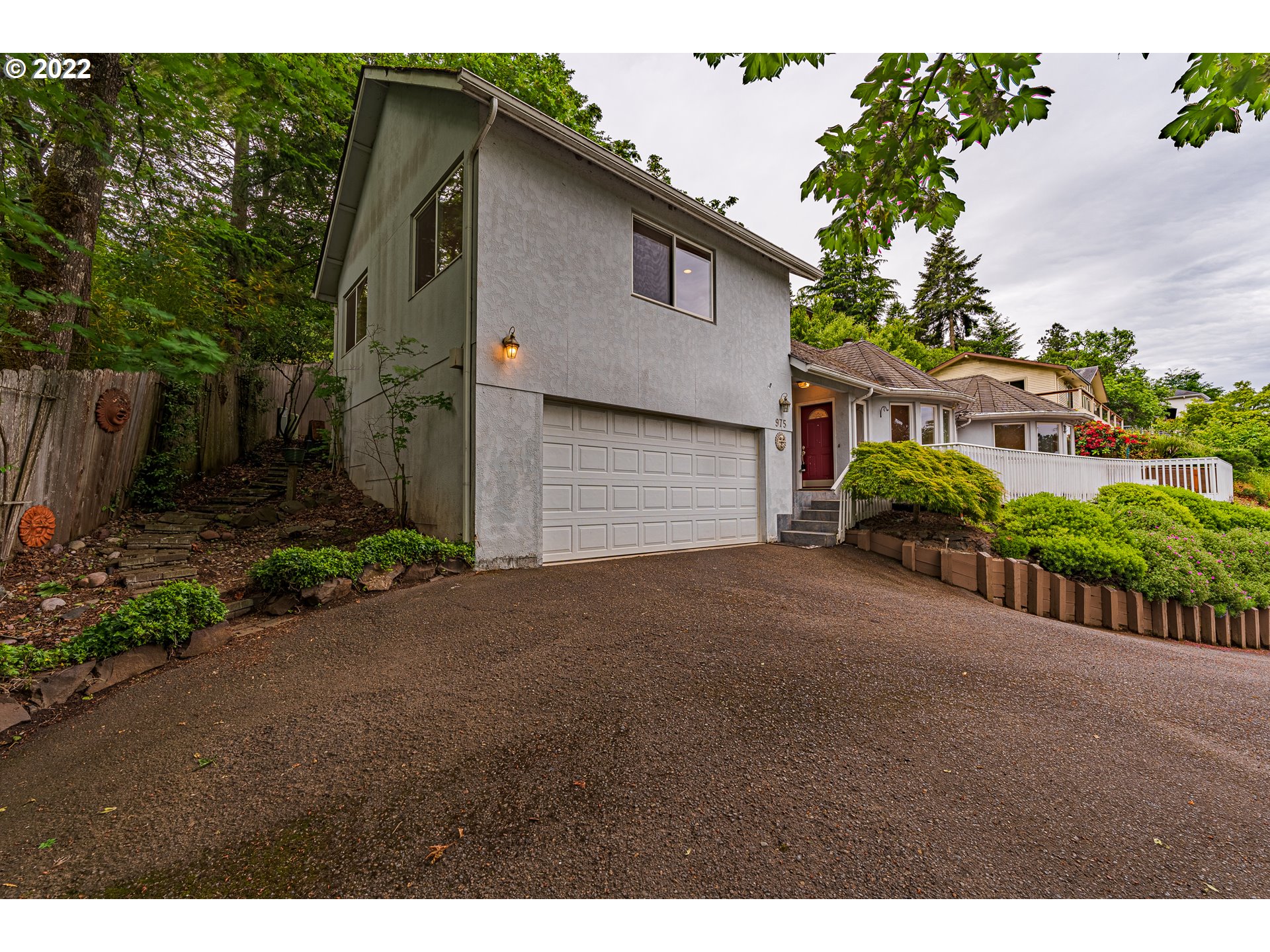 975 Sunset Drive Springfield, OR 97477 - Photo 2 of 30 a view of a house with a yard and potted plants
