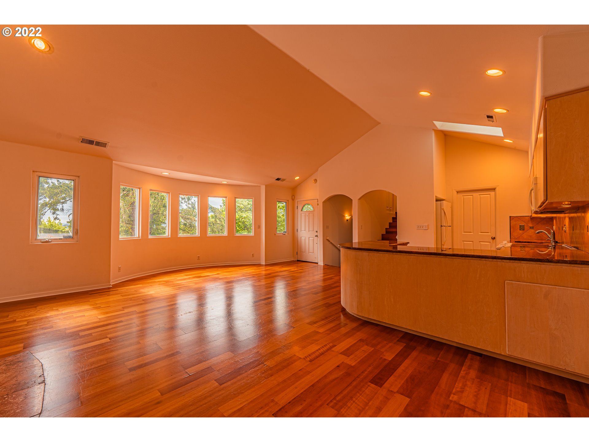 975 Sunset Drive Springfield, OR 97477 - Photo 6 of 30 a view of an empty room with window and wooden floor
