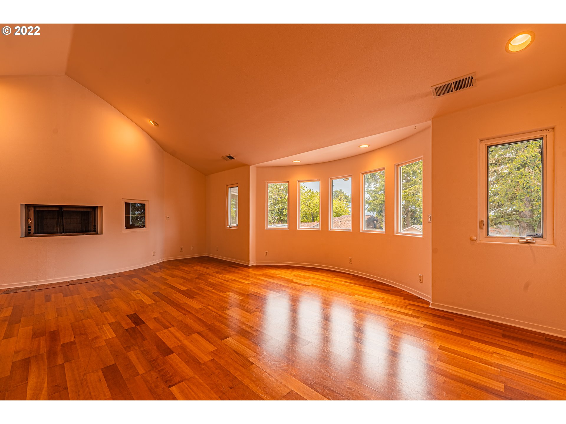975 Sunset Drive Springfield, OR 97477 - Photo 10 of 30 a view of an empty room with window and wooden floor